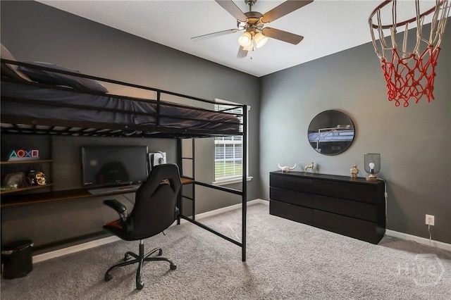 374 Bobwhite Trl NE, Ludowici, GA 31316 - bedroom featuring carpet, baseboards, a desk, and ceiling fan