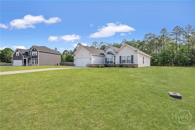 374 Bobwhite Trl NE, Ludowici, GA 31316 - view of front of property featuring concrete driveway, a front lawn, and an attached garage