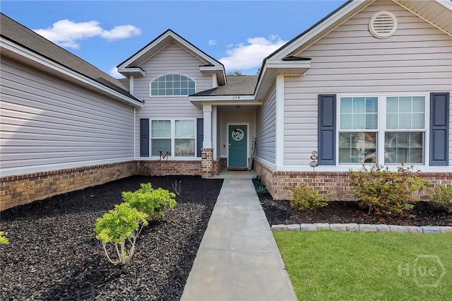 374 Bobwhite Trl NE, Ludowici, GA 31316 - view of exterior entry with brick siding
