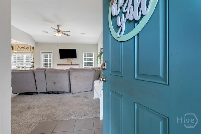 374 Bobwhite Trl NE, Ludowici, GA 31316 - carpeted foyer with tile patterned flooring and a ceiling fan