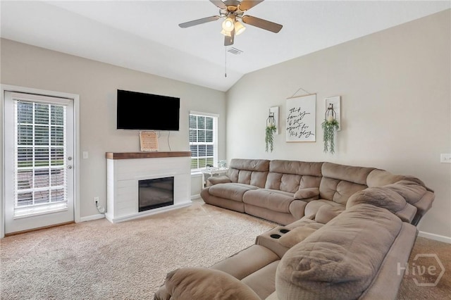 374 Bobwhite Trl NE, Ludowici, GA 31316 - living area with carpet flooring, plenty of natural light, baseboards, and vaulted ceiling