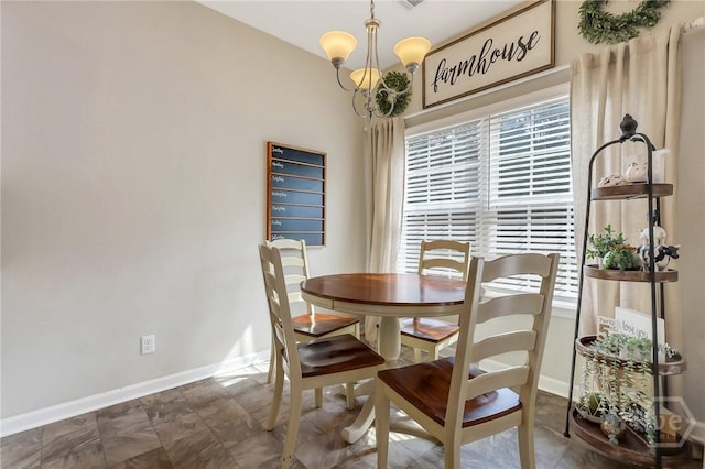374 Bobwhite Trl NE, Ludowici, GA 31316 - dining room with a chandelier and baseboards