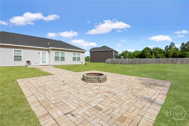 374 Bobwhite Trl NE, Ludowici, GA 31316 - view of patio with an outdoor fire pit