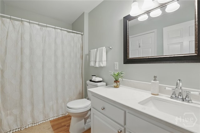 12300 Apache Ave Unit 1716, Savannah, GA 31419 - bathroom featuring wood finished floors, toilet, vanity, and curtained shower