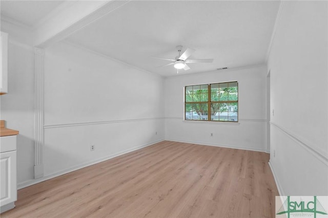 539 Pointe S Dr, Savannah, GA 31410 - spare room featuring a ceiling fan, ornamental molding, and light wood-type flooring