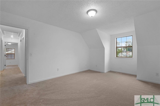 539 Pointe S Dr, Savannah, GA 31410 - bonus room with carpet flooring, attic access, a textured ceiling, and baseboards