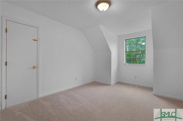 539 Pointe S Dr, Savannah, GA 31410 - bonus room featuring carpet floors, a textured ceiling, and vaulted ceiling