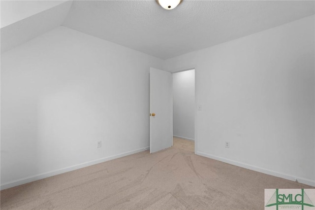 539 Pointe S Dr, Savannah, GA 31410 - carpeted empty room with a textured ceiling and baseboards