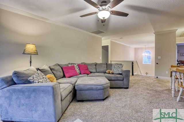 living area featuring crown molding, a ceiling fan, carpet flooring, and baseboards