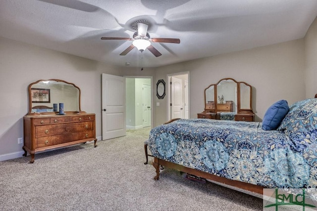 bedroom featuring carpet, baseboards, and a ceiling fan