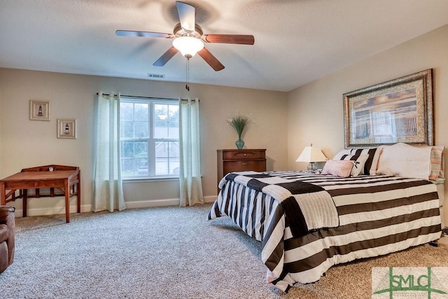 bedroom with carpet, baseboards, and ceiling fan