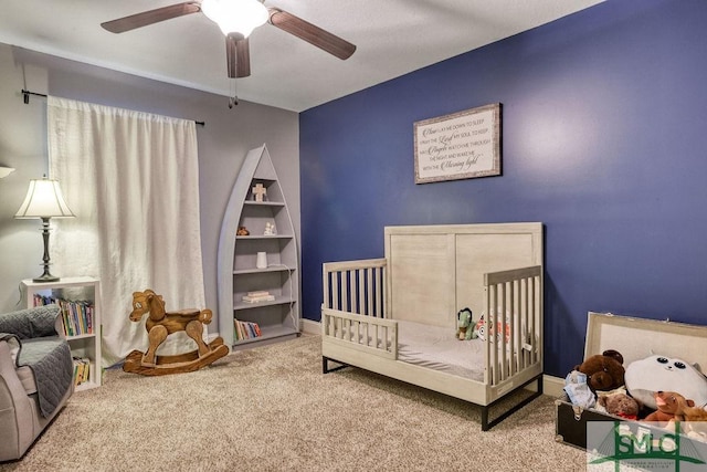 carpeted bedroom featuring ceiling fan
