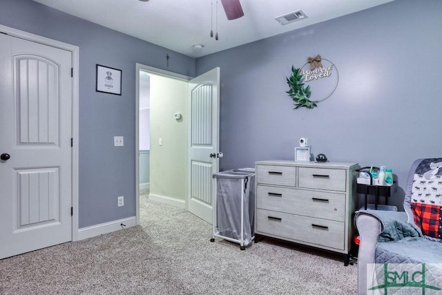 bedroom featuring light carpet, baseboards, and ceiling fan