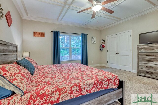 bedroom with carpet floors, coffered ceiling, ceiling fan, baseboards, and crown molding