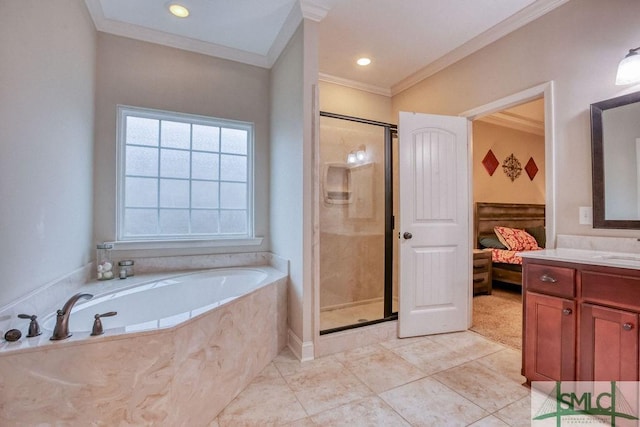ensuite bathroom with ornamental molding, a shower stall, vanity, and a garden tub