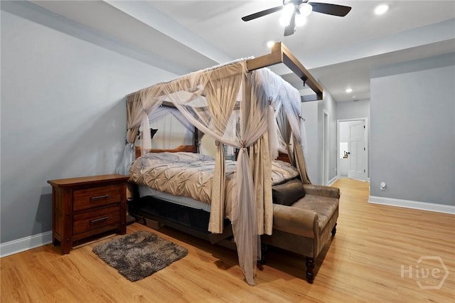 bedroom with baseboards, light wood-style flooring, ceiling fan, and recessed lighting