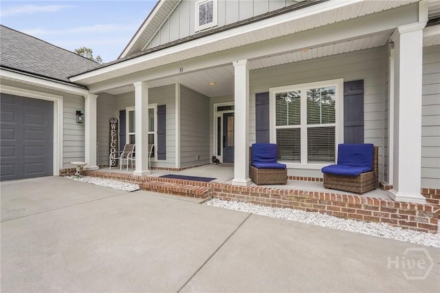 view of patio featuring covered porch and driveway