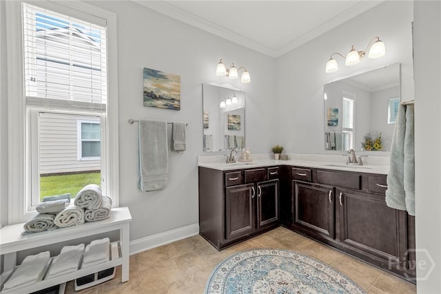 bathroom featuring crown molding, double vanity, tile patterned floors, and baseboards