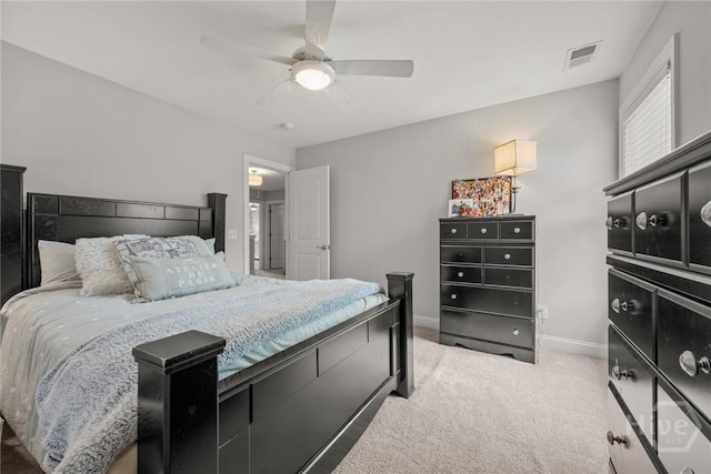 carpeted bedroom with baseboards and a ceiling fan