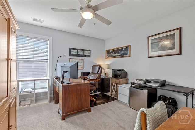 office with ceiling fan and light carpet