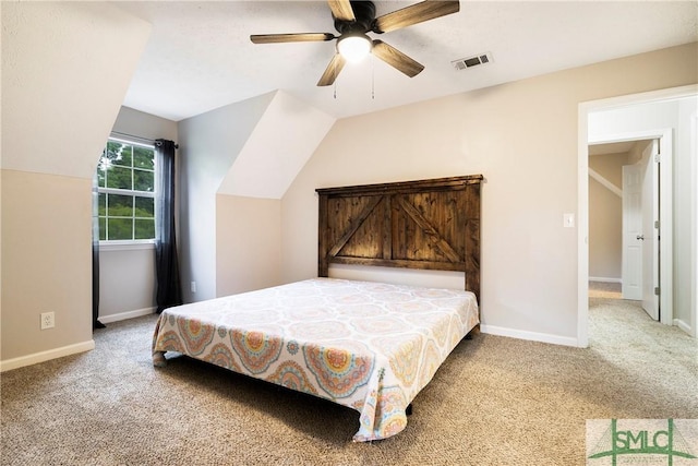 bedroom featuring carpet flooring, baseboards, a ceiling fan, and vaulted ceiling