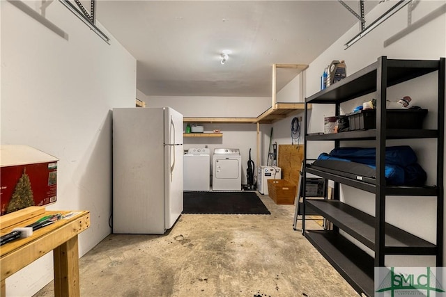 basement with freestanding refrigerator and separate washer and dryer