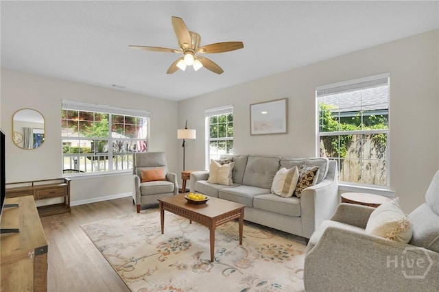 2 Mclaughlin Ct, Savannah, GA 31419 - living room featuring light wood-type flooring, ceiling fan, and baseboards