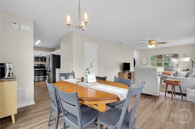2 Mclaughlin Ct, Savannah, GA 31419 - dining room with light wood-style flooring, a chandelier, and ceiling fan