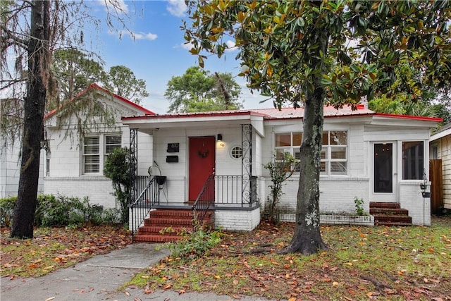 610 W 46th St, Savannah, GA 31405 - view of front of home with brick siding and entry steps