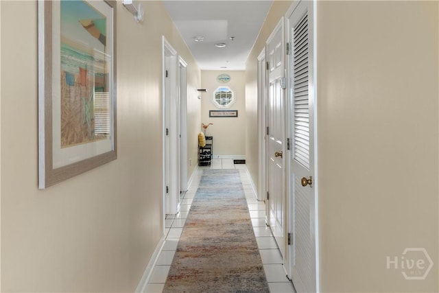 3 3rd St Unit 538, Tybee Island, GA 31328 - hallway with light tile patterned floors and baseboards