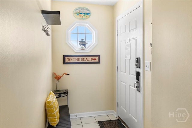 3 3rd St Unit 538, Tybee Island, GA 31328 - doorway with light tile patterned floors and baseboards
