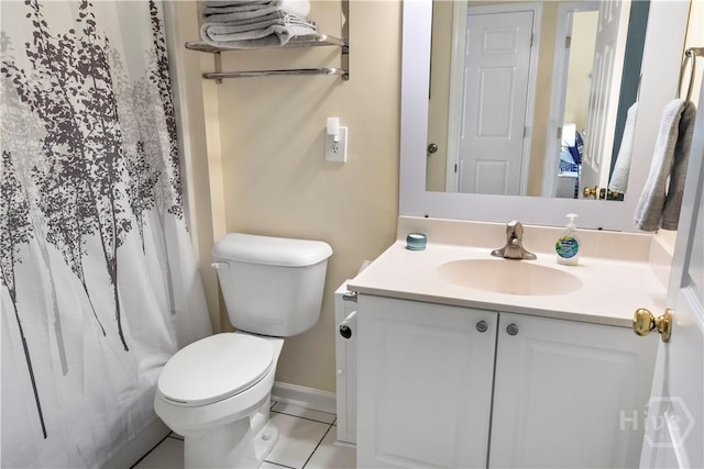 3 3rd St Unit 538, Tybee Island, GA 31328 - bathroom with toilet, vanity, baseboards, curtained shower, and tile patterned flooring