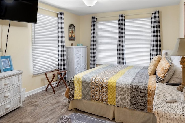 3 3rd St Unit 538, Tybee Island, GA 31328 - bedroom with multiple windows, wood finished floors, and baseboards