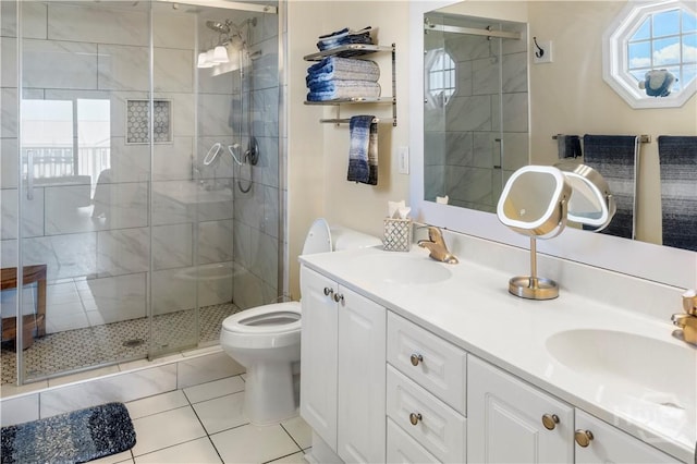 3 3rd St Unit 538, Tybee Island, GA 31328 - full bath with a shower stall, double vanity, toilet, and tile patterned floors