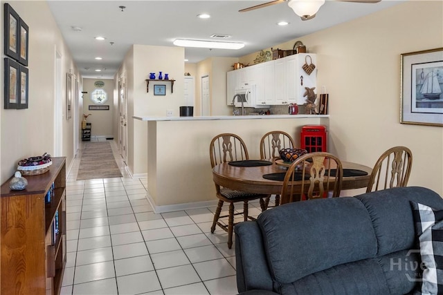3 3rd St Unit 538, Tybee Island, GA 31328 - dining area featuring a ceiling fan, light tile patterned flooring, recessed lighting, and baseboards