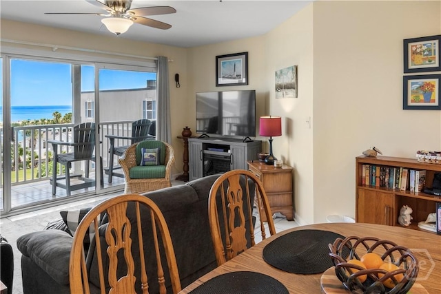 3 3rd St Unit 538, Tybee Island, GA 31328 - dining space with ceiling fan, a water view, and a fireplace