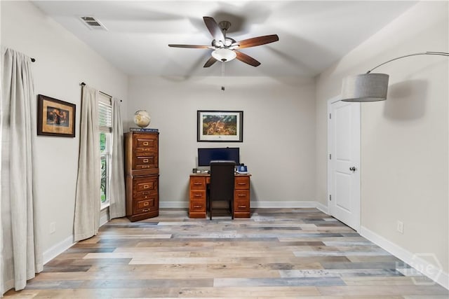 office with ceiling fan, light wood finished floors, and baseboards