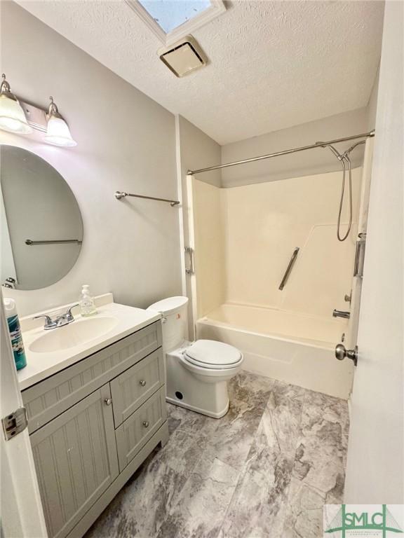932 Millstream Ct, Savannah, GA 31419 - bathroom with a textured ceiling, toilet, vanity, and shower / bathtub combination