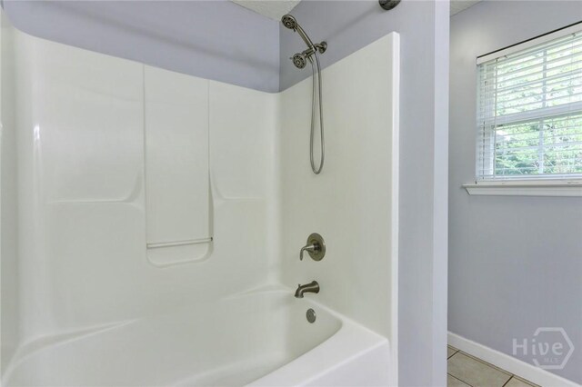 30 Bridgewater Way, Brunswick, GA 31525 - full bath with tile patterned flooring, baseboards, and bathtub / shower combination