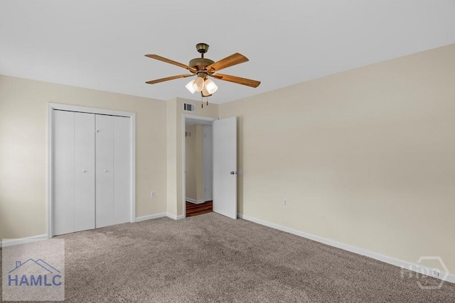1021 Bacon Rd, Hinesville, GA 31313 - unfurnished bedroom featuring carpet flooring, baseboards, a closet, and a ceiling fan