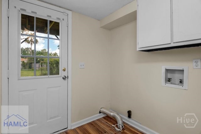 1021 Bacon Rd, Hinesville, GA 31313 - clothes washing area with cabinet space, baseboards, wood finished floors, and hookup for a washing machine