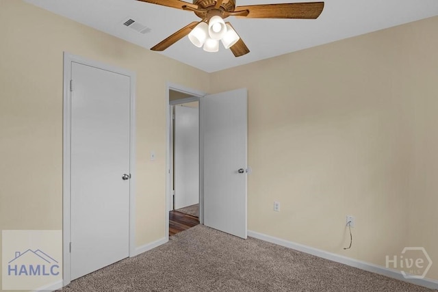 1021 Bacon Rd, Hinesville, GA 31313 - unfurnished bedroom with carpet flooring, baseboards, and a ceiling fan