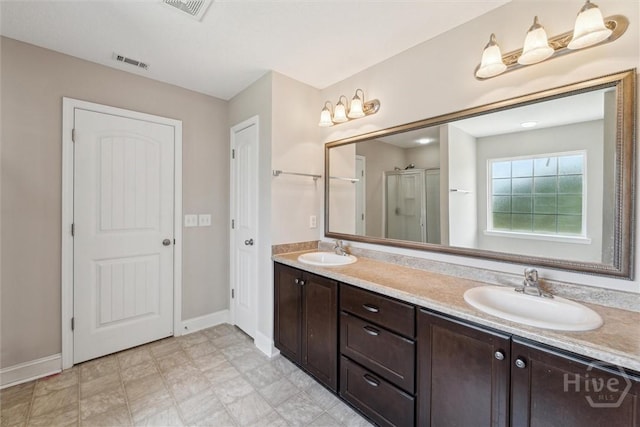 1107 Creekside Cir, Hinesville, GA 31313 - bathroom featuring a stall shower, baseboards, and double vanity