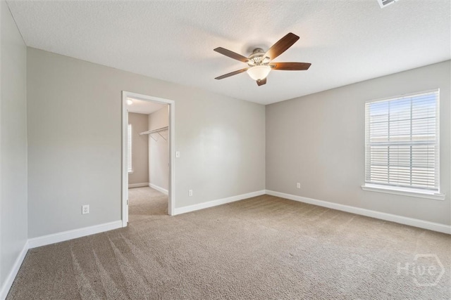 1107 Creekside Cir, Hinesville, GA 31313 - carpeted spare room featuring a ceiling fan, baseboards, and a textured ceiling