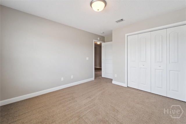 1107 Creekside Cir, Hinesville, GA 31313 - unfurnished bedroom with carpet floors, baseboards, and a closet