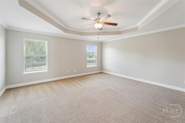 1107 Creekside Cir, Hinesville, GA 31313 - empty room featuring a raised ceiling, crown molding, ceiling fan, carpet, and baseboards