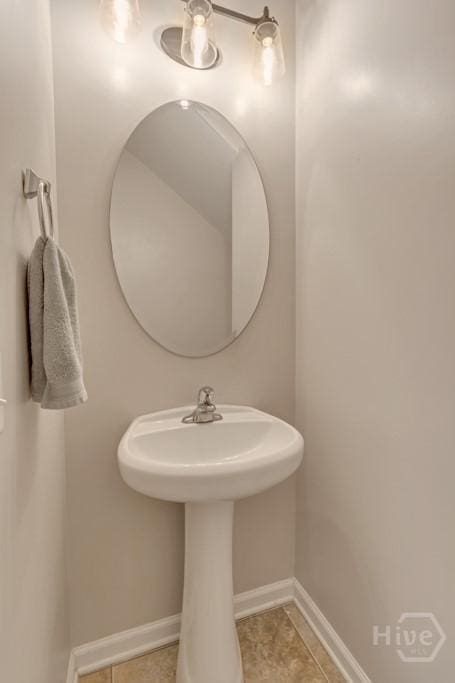 48 Chapel Lk N, Savannah, GA 31419 - bathroom featuring tile patterned flooring, a sink, and baseboards