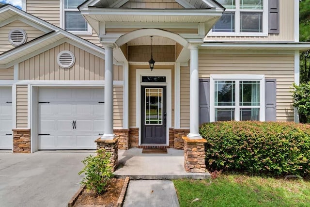 48 Chapel Lk N, Savannah, GA 31419 - entrance to property featuring stone siding, driveway, a garage, and a porch