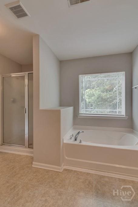 48 Chapel Lk N, Savannah, GA 31419 - bathroom featuring a stall shower, tile patterned flooring, and a garden tub