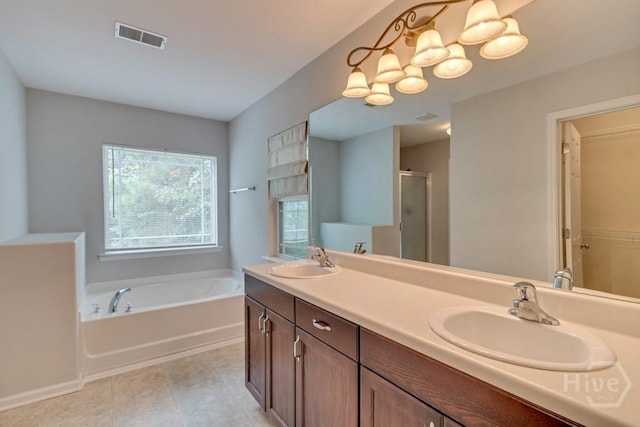 48 Chapel Lk N, Savannah, GA 31419 - full bathroom with plenty of natural light, a garden tub, a shower stall, and tile patterned floors